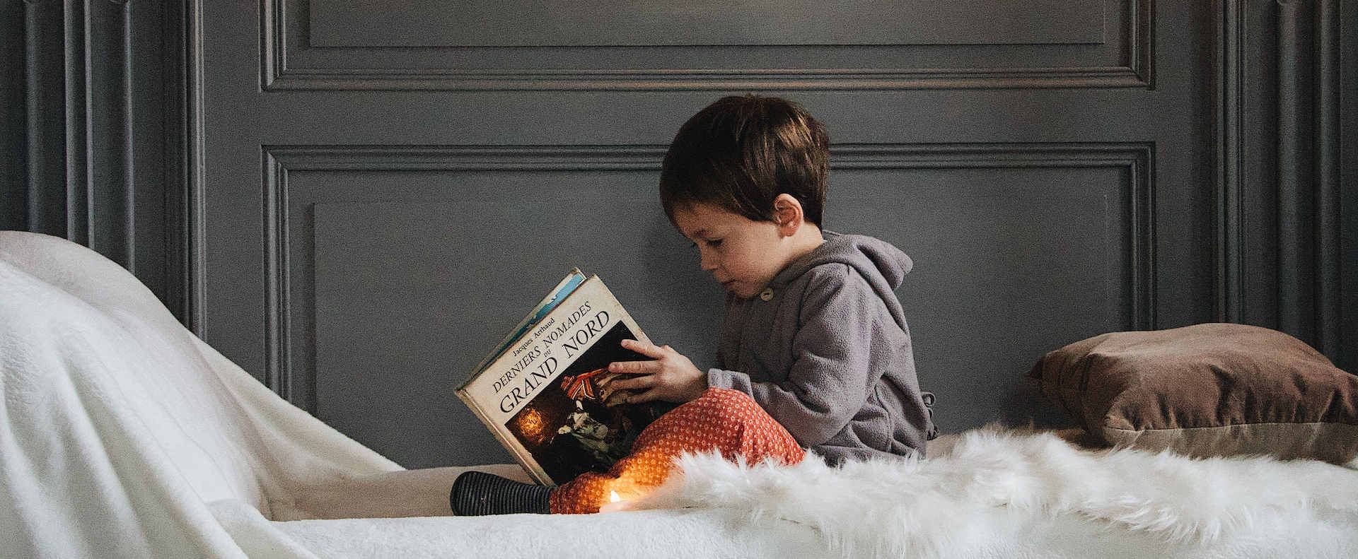 Boy Reading to Himself